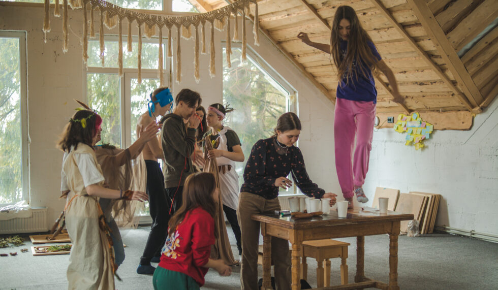 Campers hiking in the Carpathians framed by morning light.